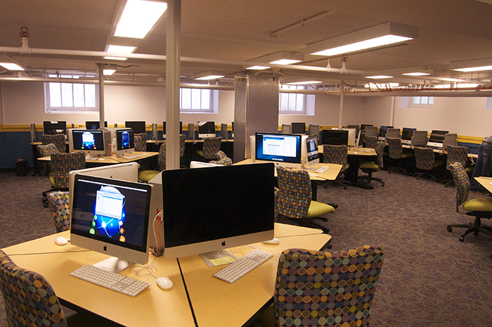 computer lab with desks, computers and chairs